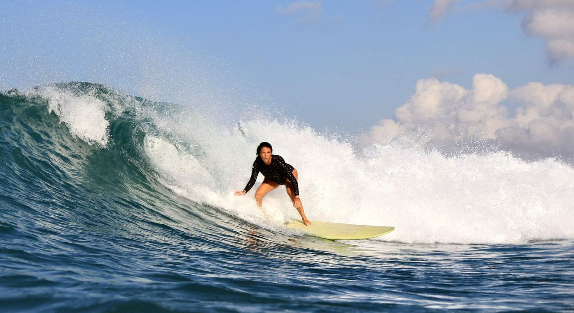 Surfer riding a wave with confidence